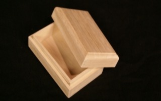 Custom-shaped wooden box with a smooth finish, designed for specialty packaging and available in high-volume production runs.